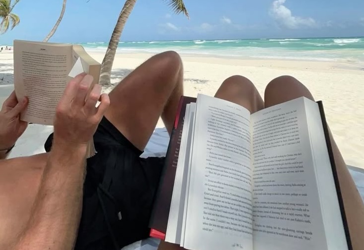 Happy couple sharing a joyful moment in a field of wildflowers