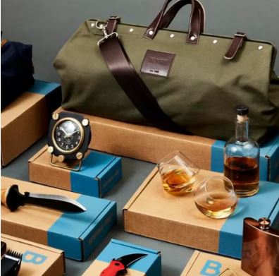 Premium subscription boxes with men's accessories, watches, and whiskey